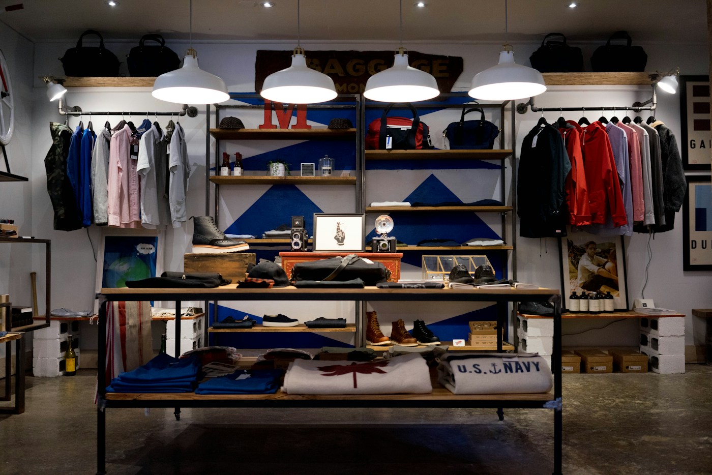 A retail store interior with clothing displays