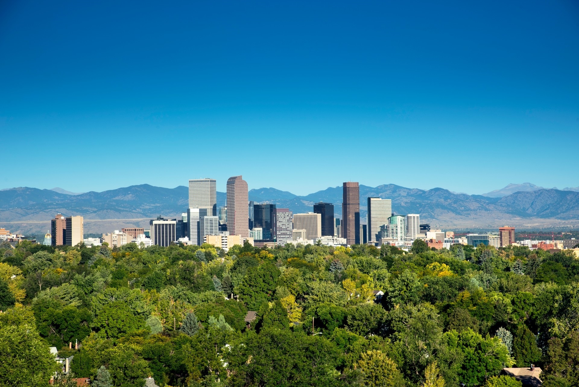 The Denver skyline set against the Rocky Mountains