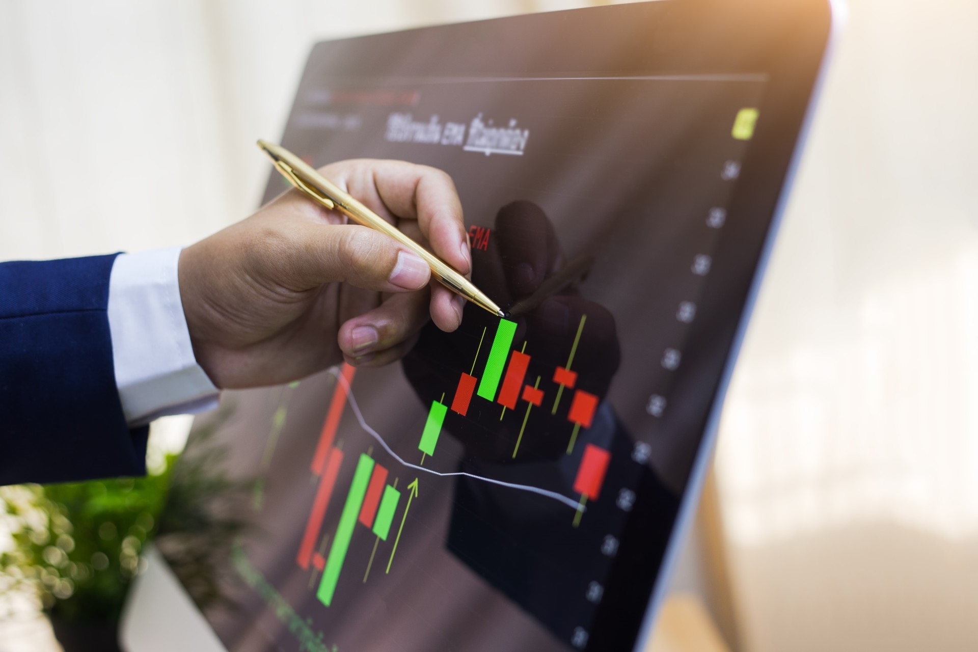 A financial professional reviewing market information